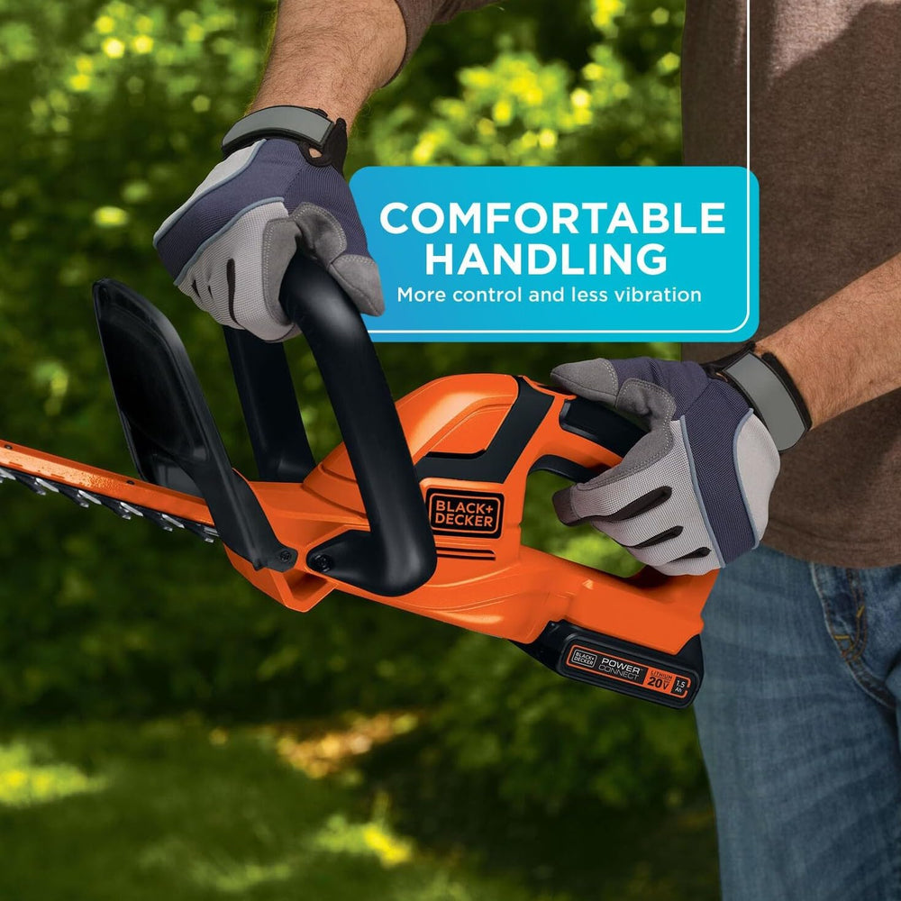 BLACK+DECKER hedge trimmer used horizontally showing clean even cuts on shrubbery