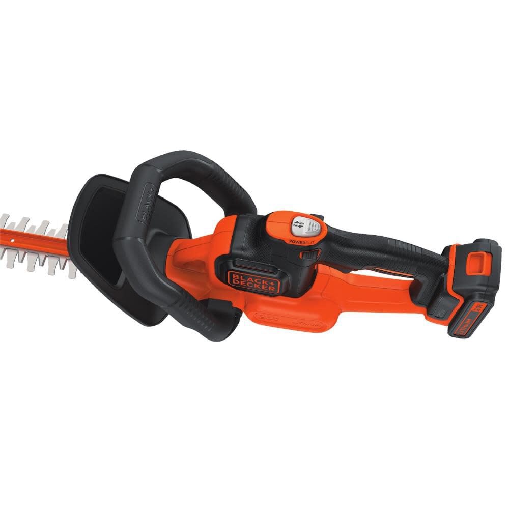 BLACK+DECKER trimmer in use shaping hedge for efficient trimming