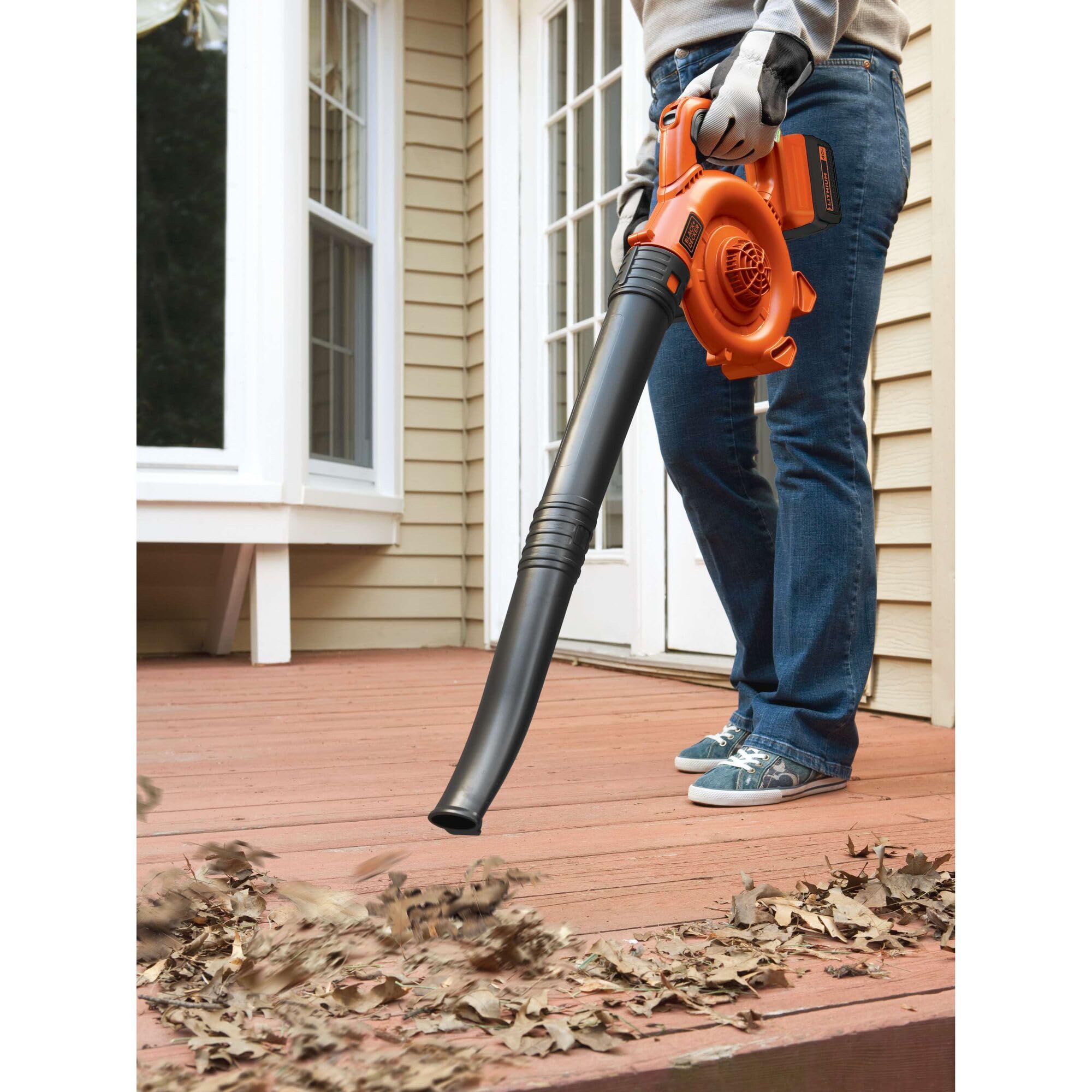 BLACK+DECKER on a wooden deck demonstrating quiet operation in a lifestyle setting