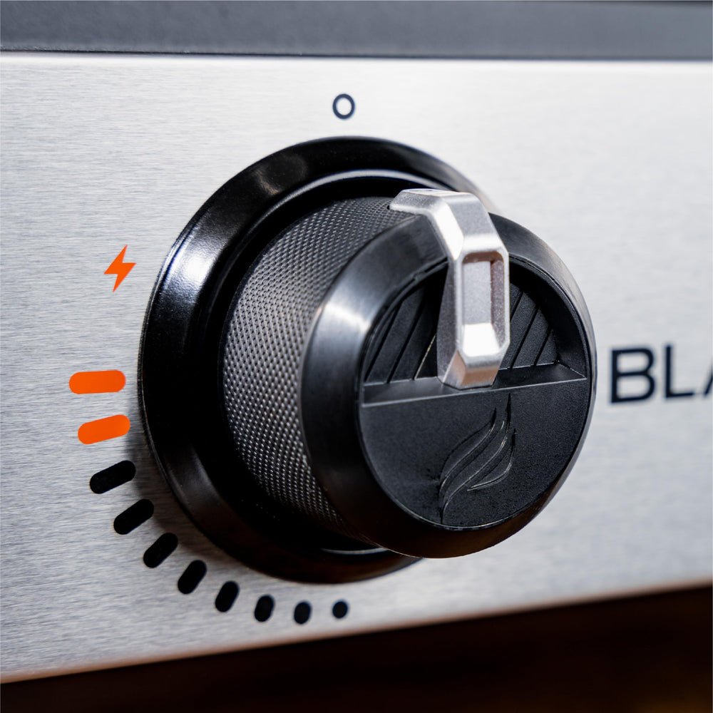 Blackstone 1666 rear grease cup detail demonstrating easy cleanup and mess reduction benefit