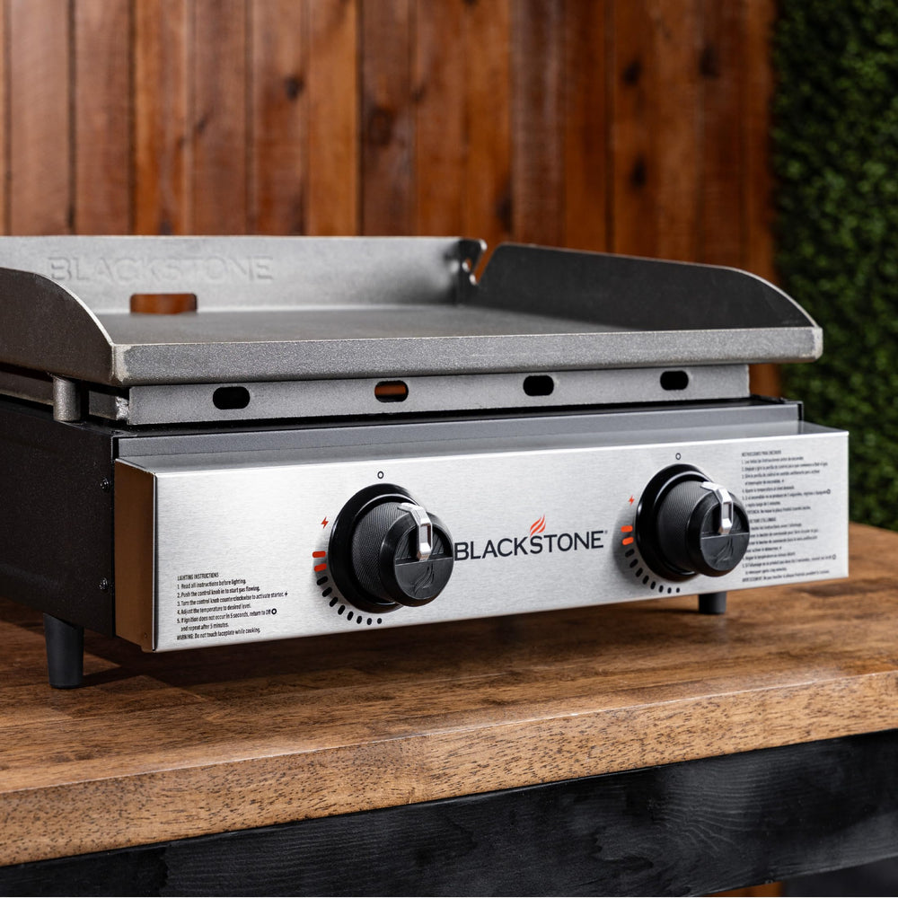 Blackstone 1666 next to a cooler for scale showing compact footprint and transport ease benefit