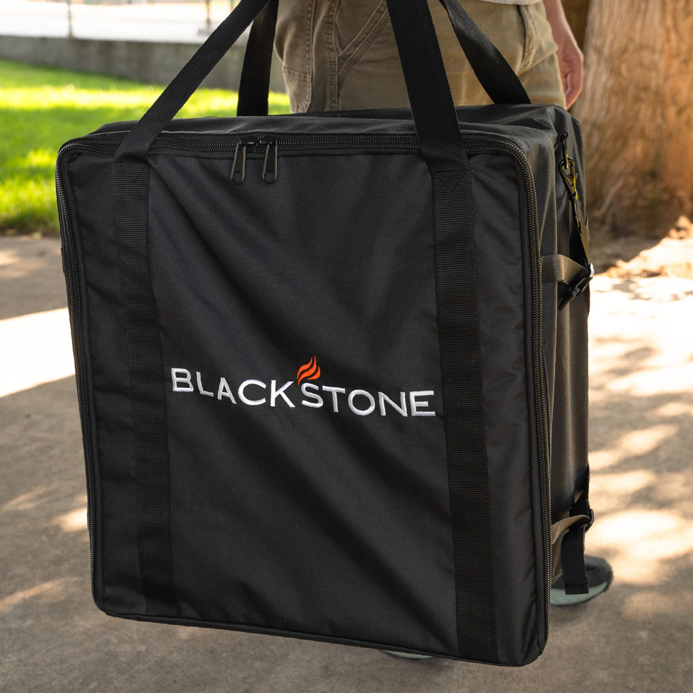 Blackstone carry bag in tailgate setting enabling easy transport