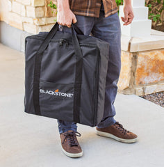 BLACKSTONE griddle bag being carried to campsite demonstrating weather resistance and portability
