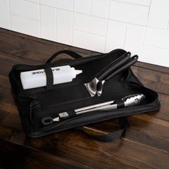 BLACKSTONE tongs in use on griddle turning food, offering secure grasp and safe handling