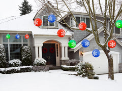 BlissfulTie inflated ornaments arranged on a porch adding instant festive curb attraction