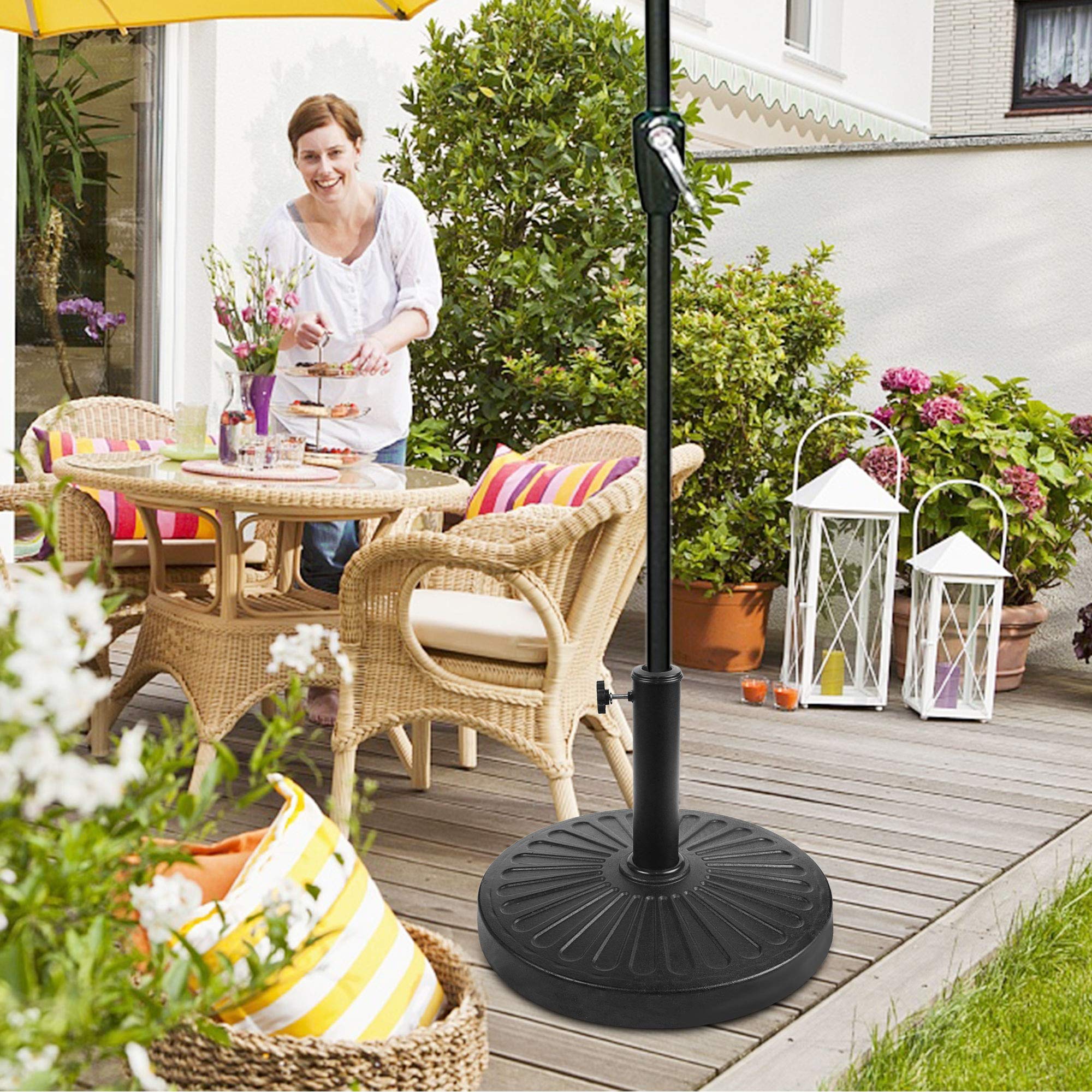 Blissun base in-use at a patio dining table adding steady umbrella support