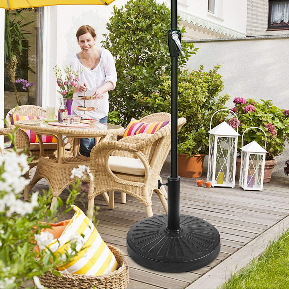 Blissun base in-use at a patio dining table adding steady umbrella support