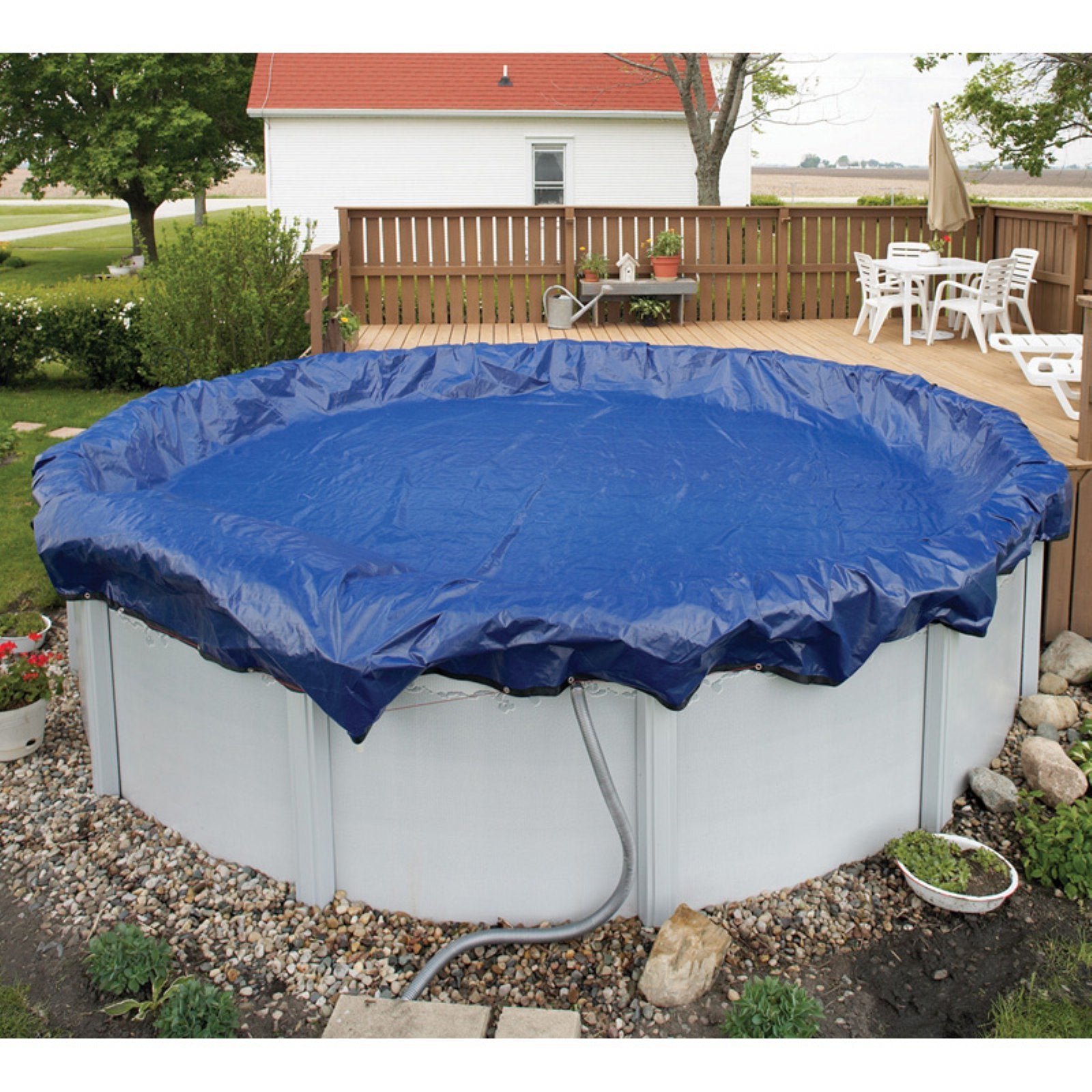 Blue Wave installed on 28-ft round pool showing secure fit and debris barrier