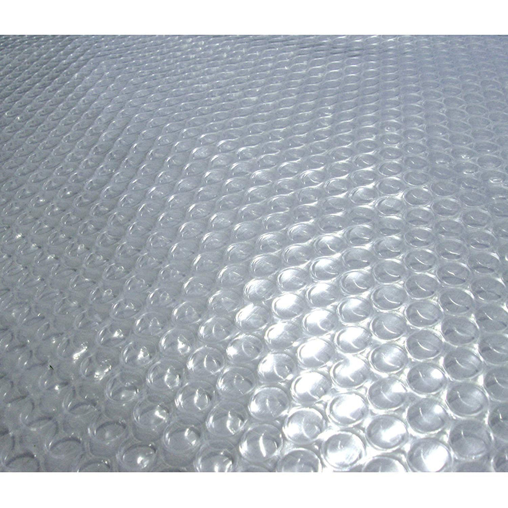 Blue Wave front view of clear solar cover on pool, increases warmth