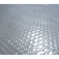 Blue Wave front view of clear solar cover on pool, increases warmth