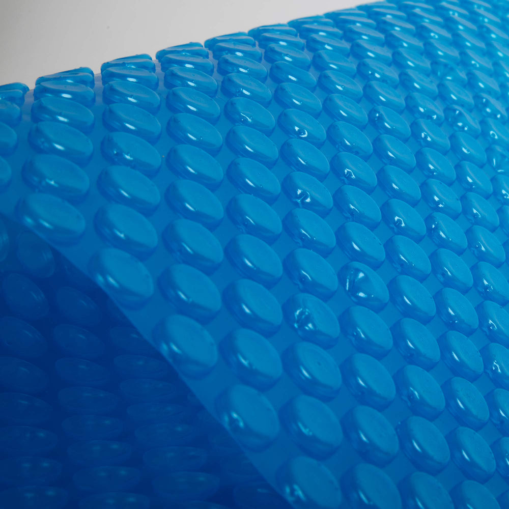 Blue Wave cover floating on pool surface providing insulation