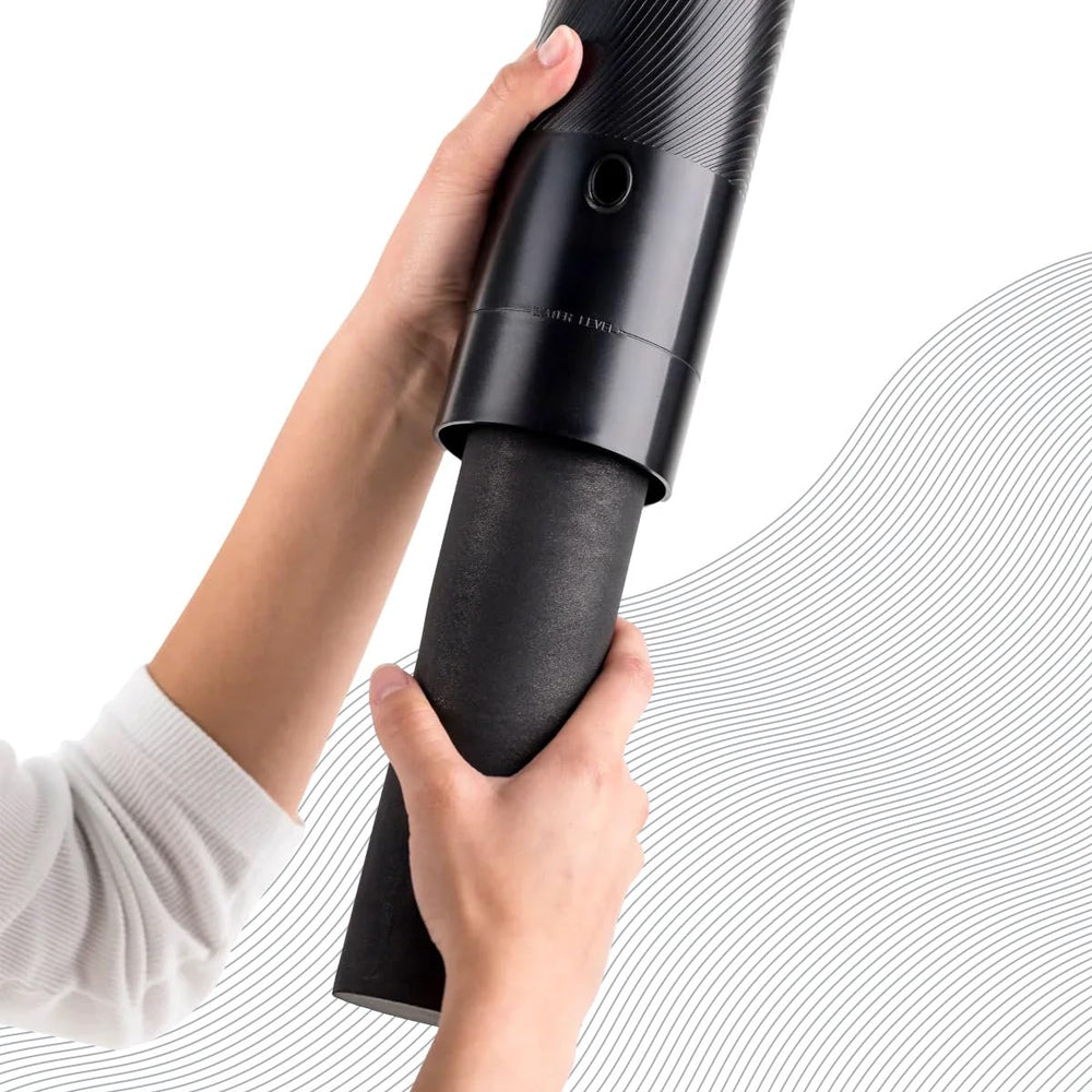BOROUX pump in hand for scale showing compact size and easy handling