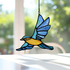 BOXCASA suncatcher in sunlit window casting vivid blue tones and ambiance