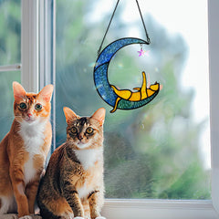 BOXCASA suncatcher hanging in a sunlit window creating vibrant light play