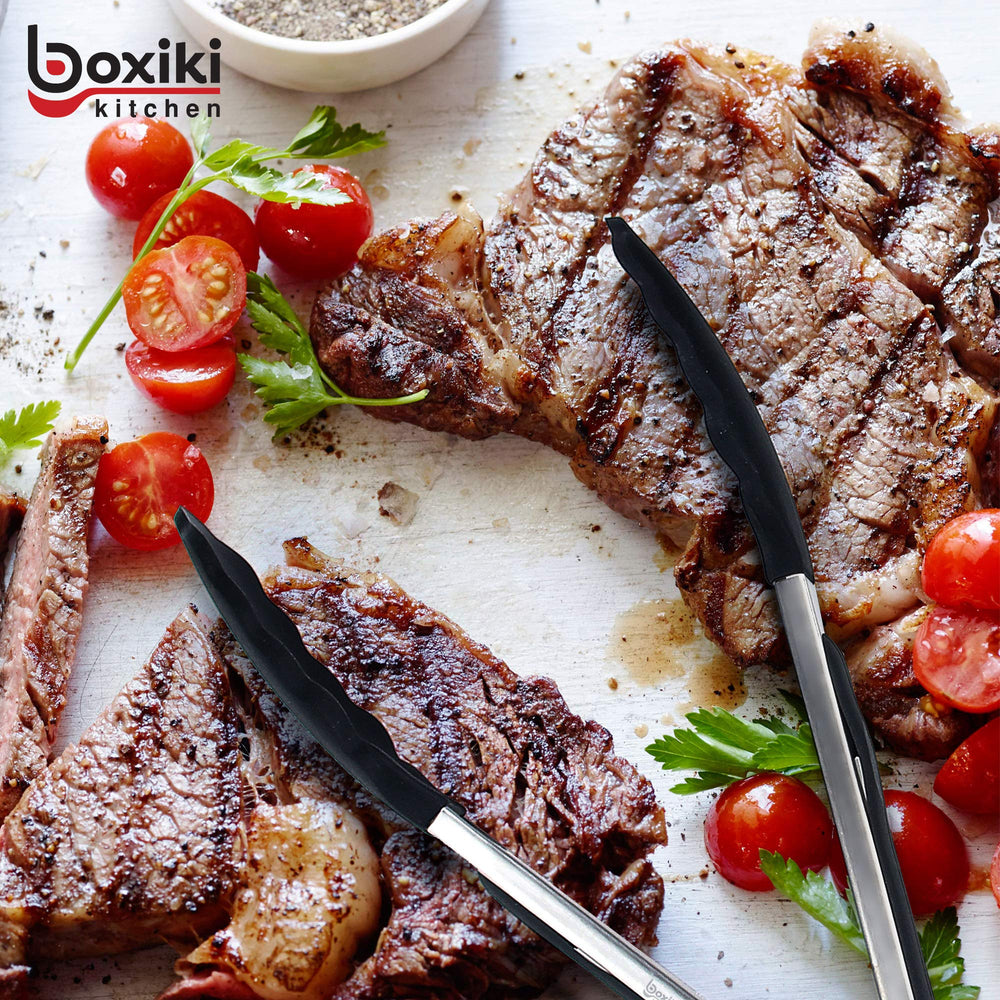 Boxiki Kitchen tongs in use on grill flipping burger with heat-resistant control