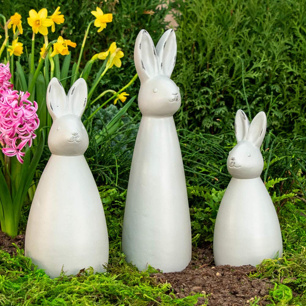 BRECK'S front view of three bunnies grouped by a flowerbed adding modern charm