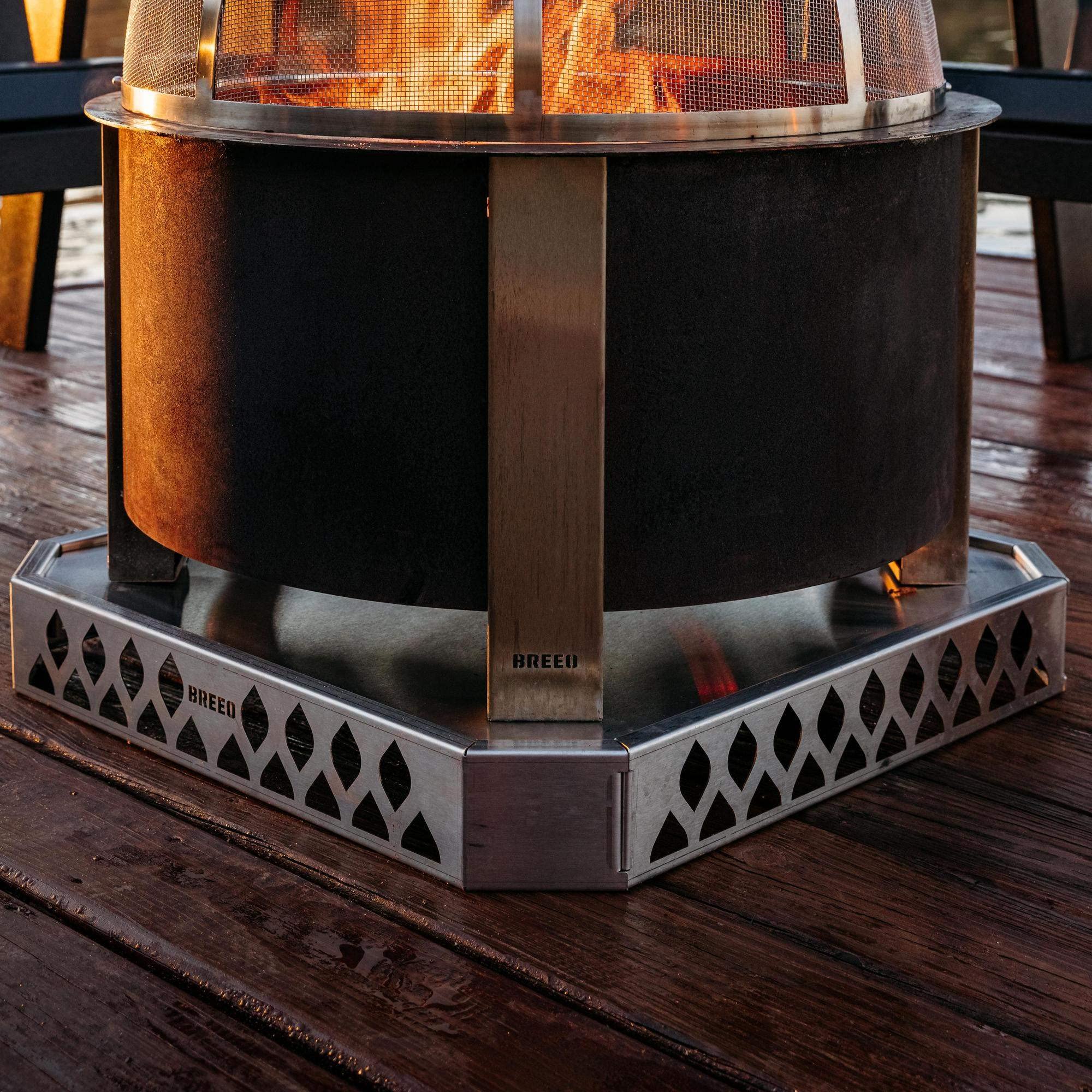 Breeo Base X in use under an X Series fire pit protecting a wooden deck