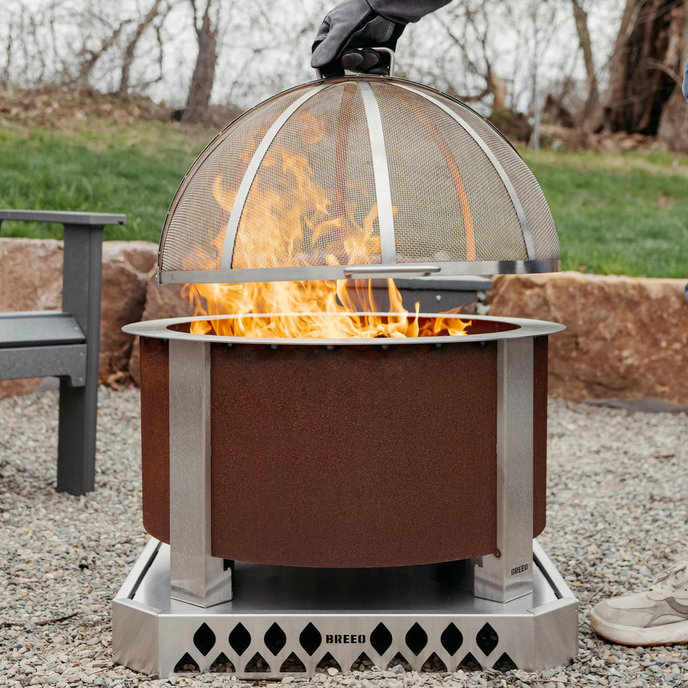 Breeo hinged top open for easy wood access and safer fire tending