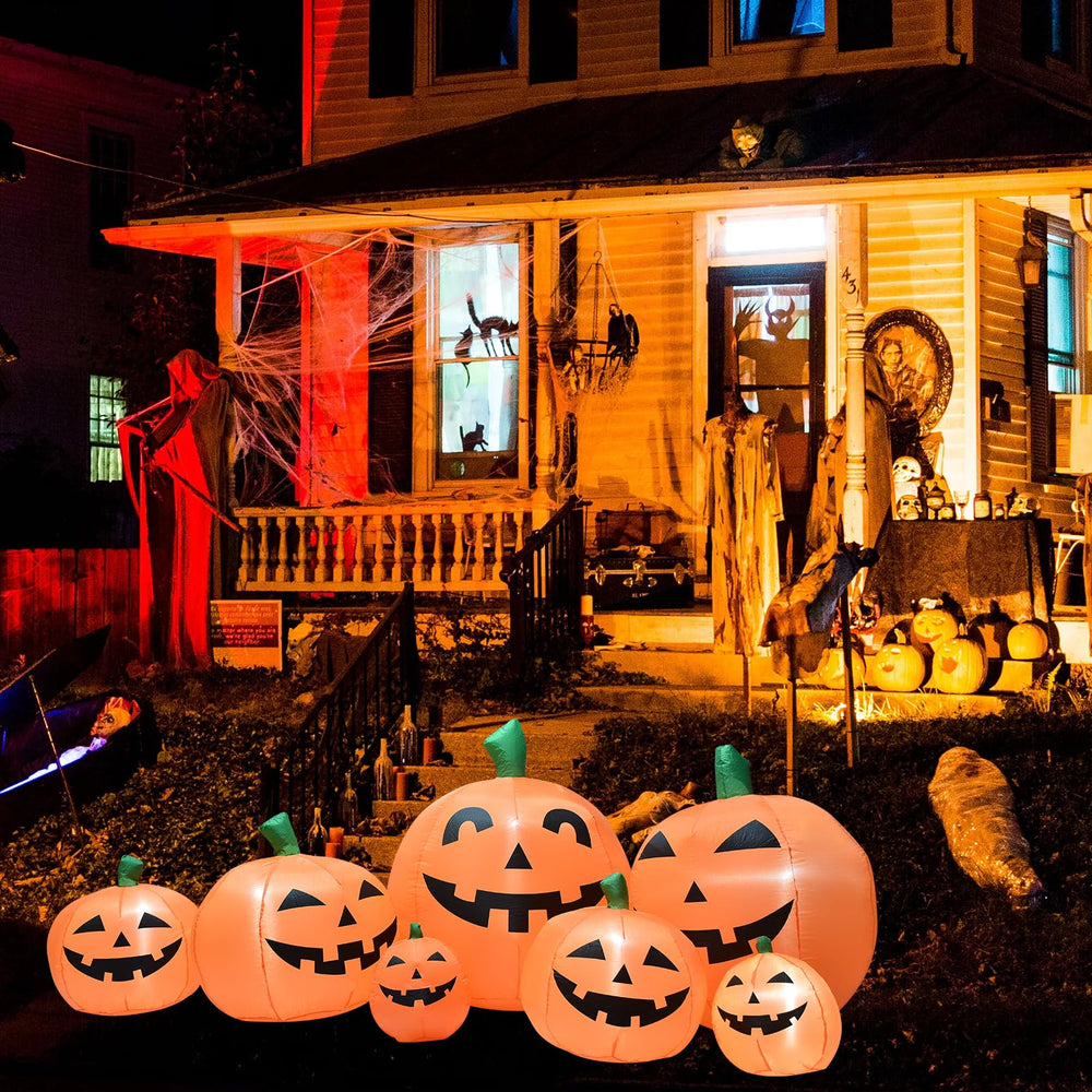 BREONLY LED lights glowing inside larger pumpkins for nighttime impact