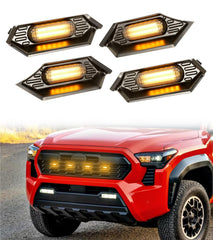 BreTrewri front grille installed on Tacoma showing integrated amber LEDs and improved visibility