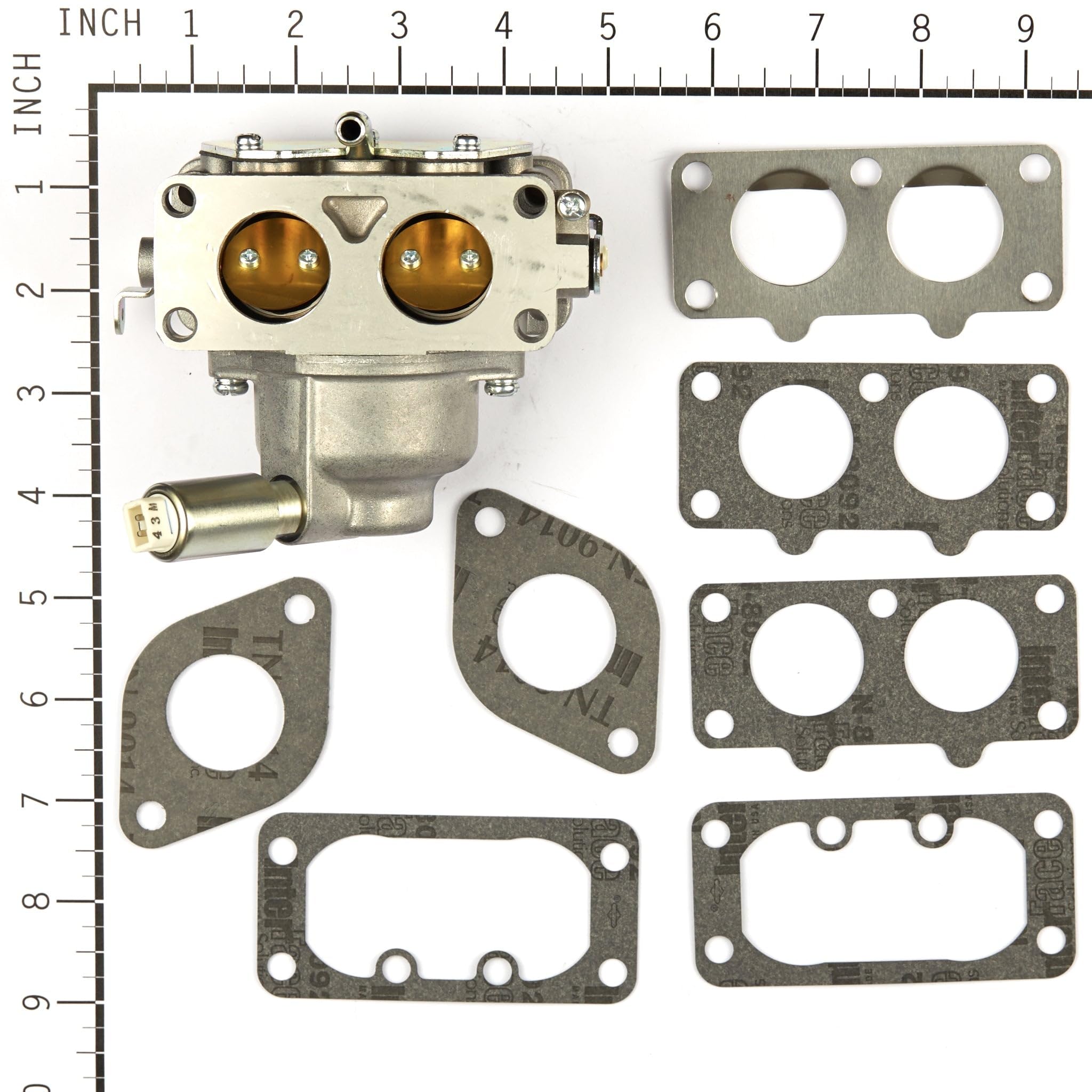 Briggs & Stratton carburetor held in hand to show compact scale and fit