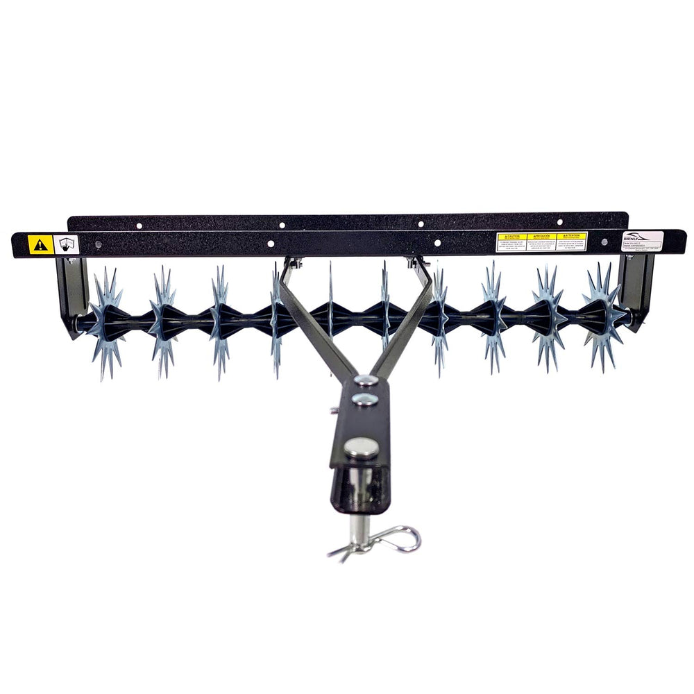 Brinly rotating stars in motion creating aeration holes to improve lawn drainage