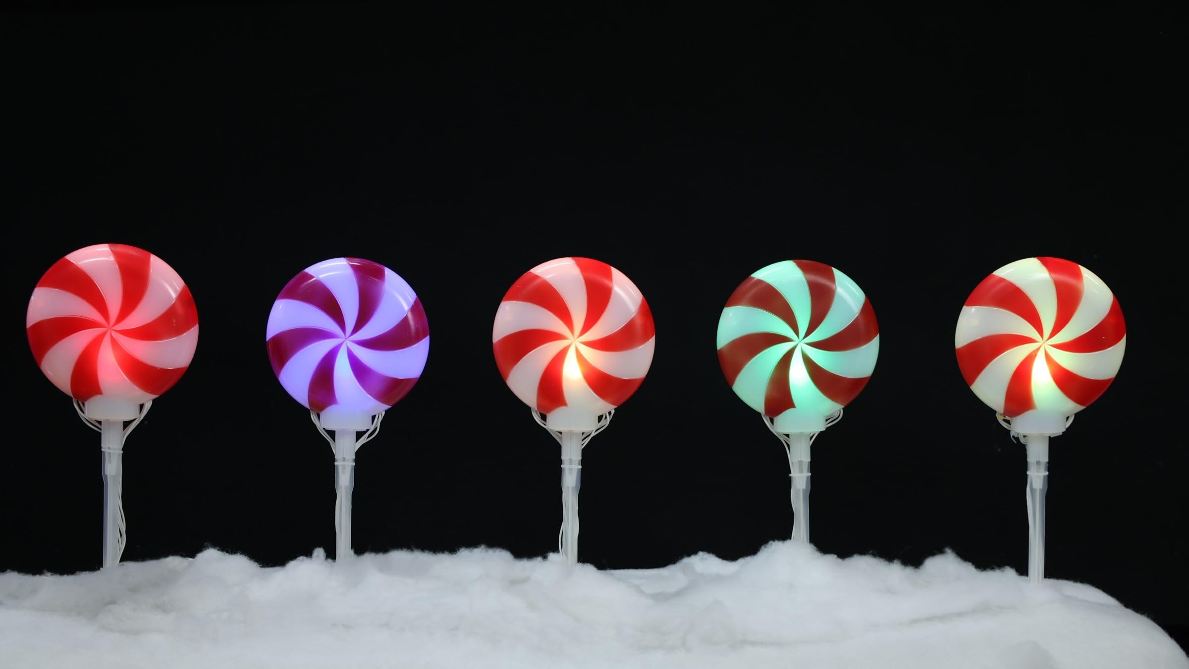 brite star front view of five lollipop pathmarkers creating festive pathway glow