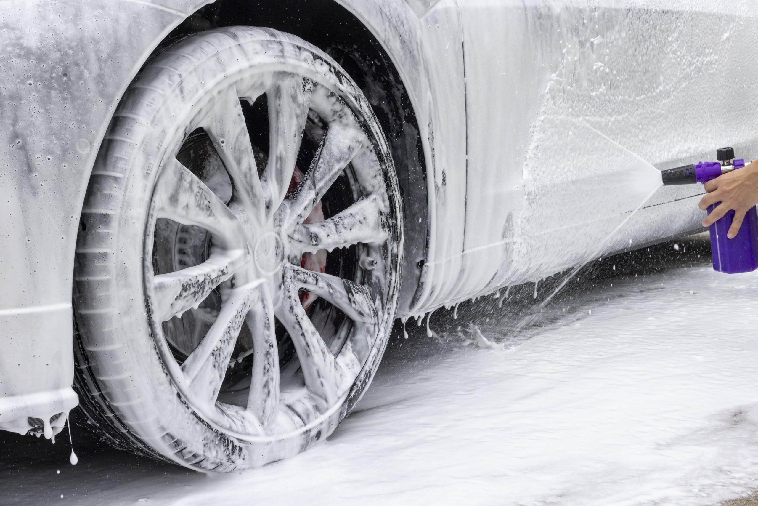 Brug's foam cannon spraying thick foam on car for safer, efficient cleaning