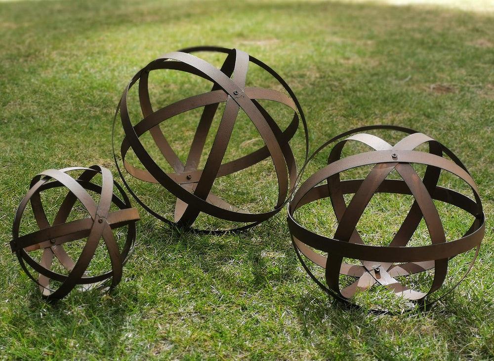 BSTGIFTS front view of three metal garden spheres showing rustic visual appeal and sculptural form