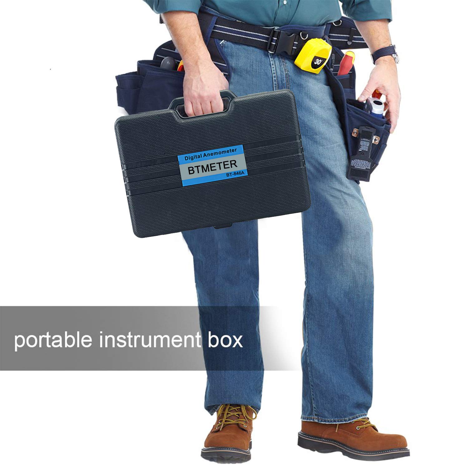 BTMETER held in hand next to a ruler showing compact scale and portability