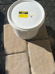 Cured BuddingCo polymeric sand joint between pavers demonstrating durable bonded results