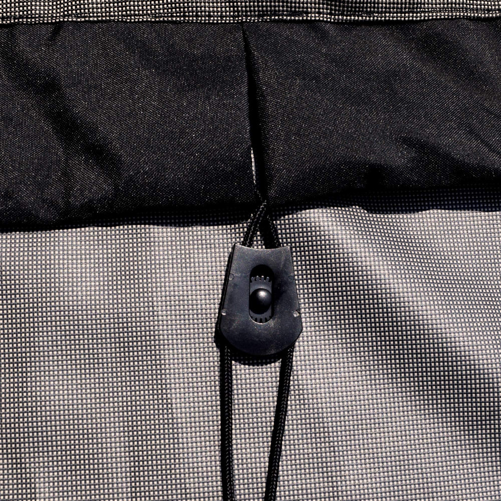 Budge straps and buckles secured to chair leg for wind-resistant fastening