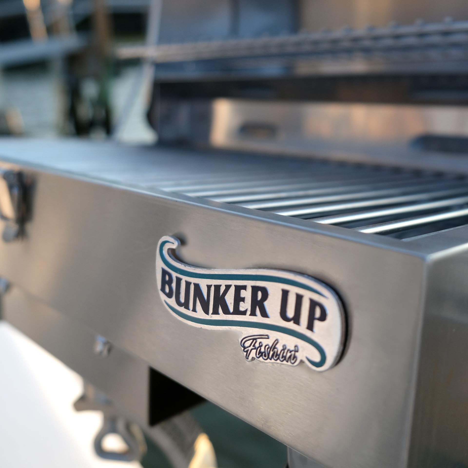 Bunker Up Fishin' grill in use on boat deck showing practical on-water cooking