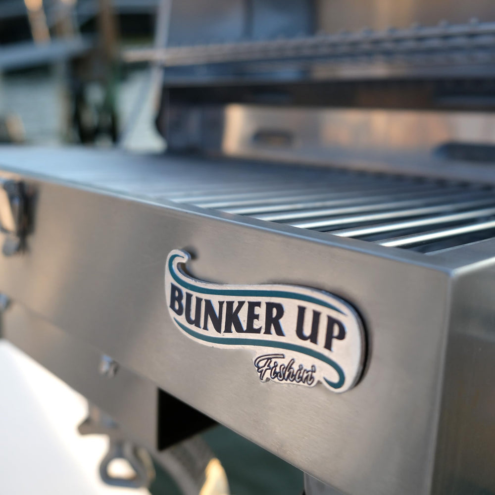 Bunker Up Fishin' grill in use on boat deck showing practical on-water cooking