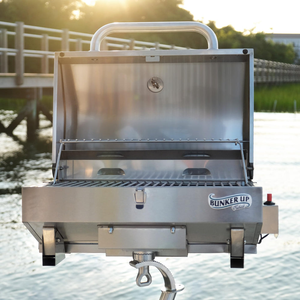 Bunker Up Fishin' grill next to propane canister showing compact size and scale