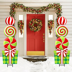 Bunny Chorus paired lollipop signs installed in a front lawn for festive curb impact