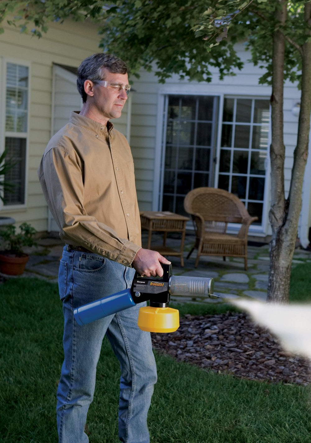 Burgess 1443 beside tall propane cylinder showing compatible power source and portability