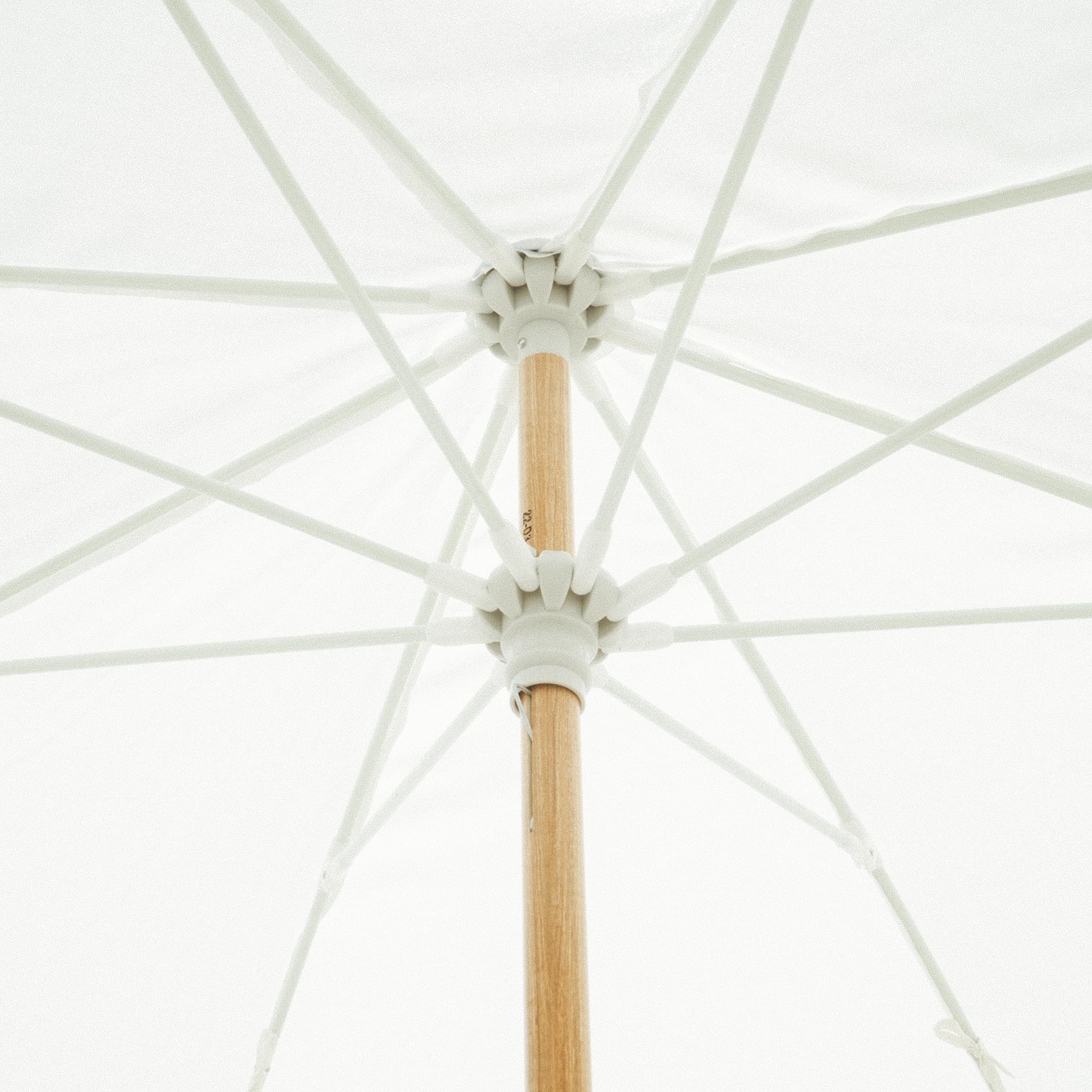 Business & Pleasure Co. umbrella set up on beach showing portability and comfort benefit