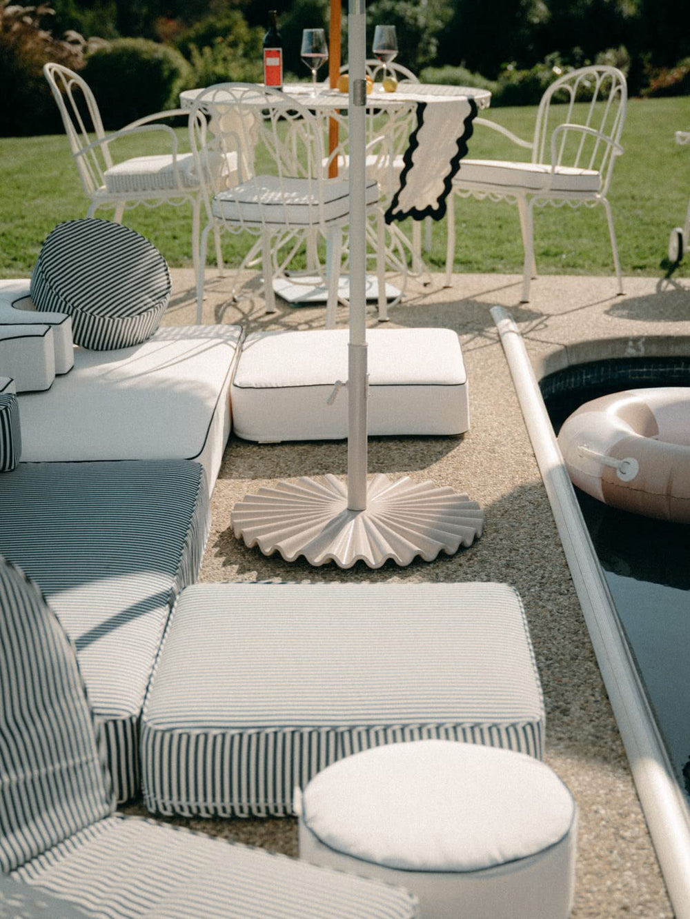 Business & Pleasure Co. Clamshell Base in a patio lifestyle scene showing cohesive design and curb appeal