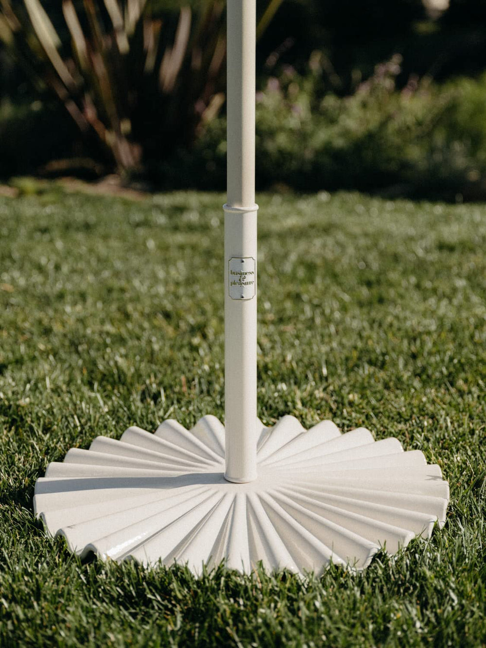 Business & Pleasure Co. pole insert detail showing secure fit for smaller-diameter umbrella poles