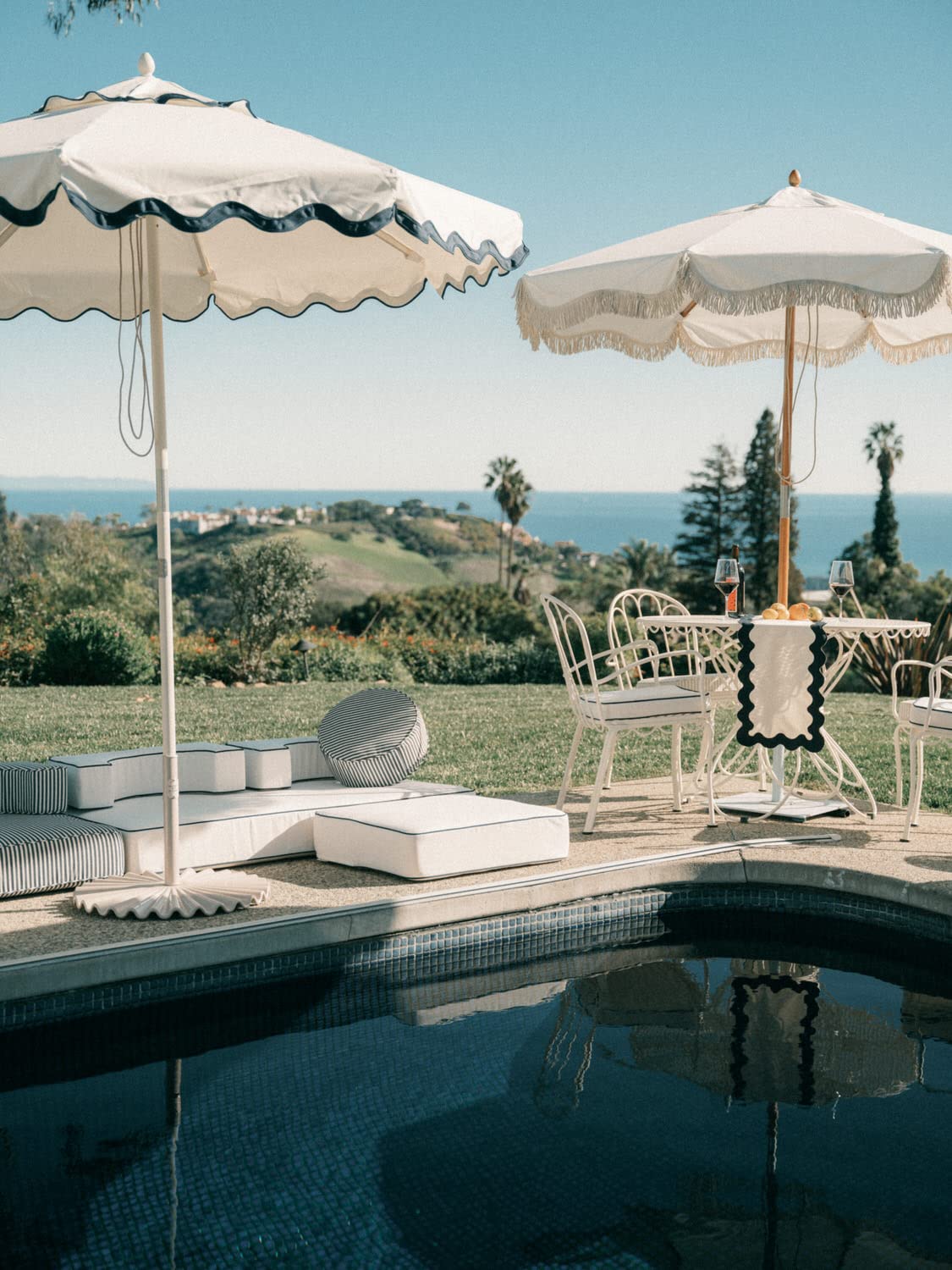 Business & Pleasure Co. base beside patio chair showing 55 lb scale and compact footprint