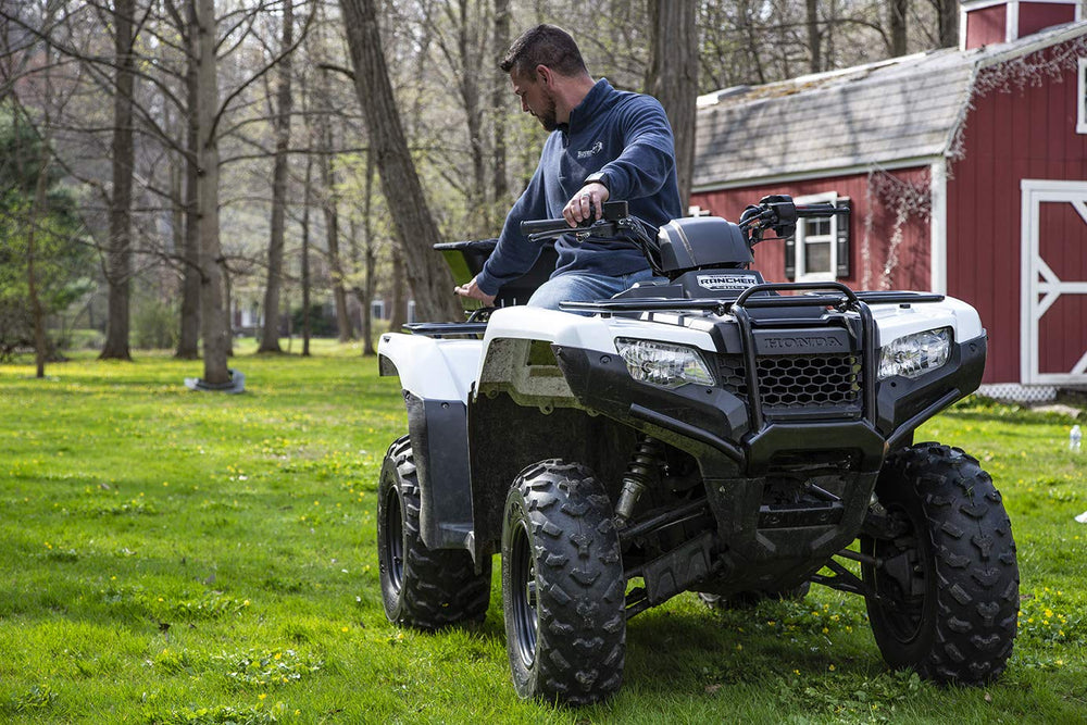 Buyers Products ATVS100 spreading action showing wide 30-foot coverage benefit