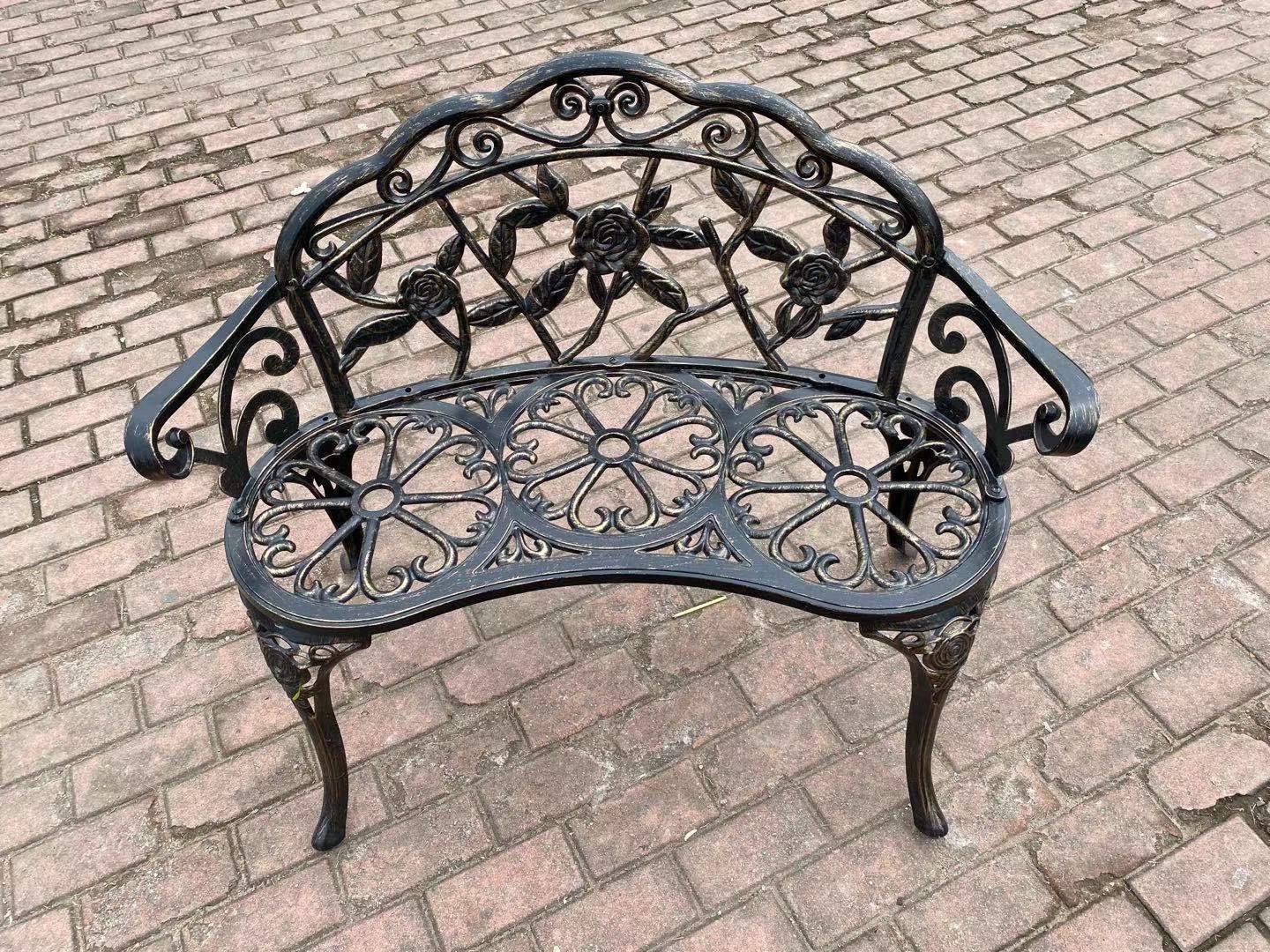 C/G patio casa bench next to chair for scale showing compact footprint