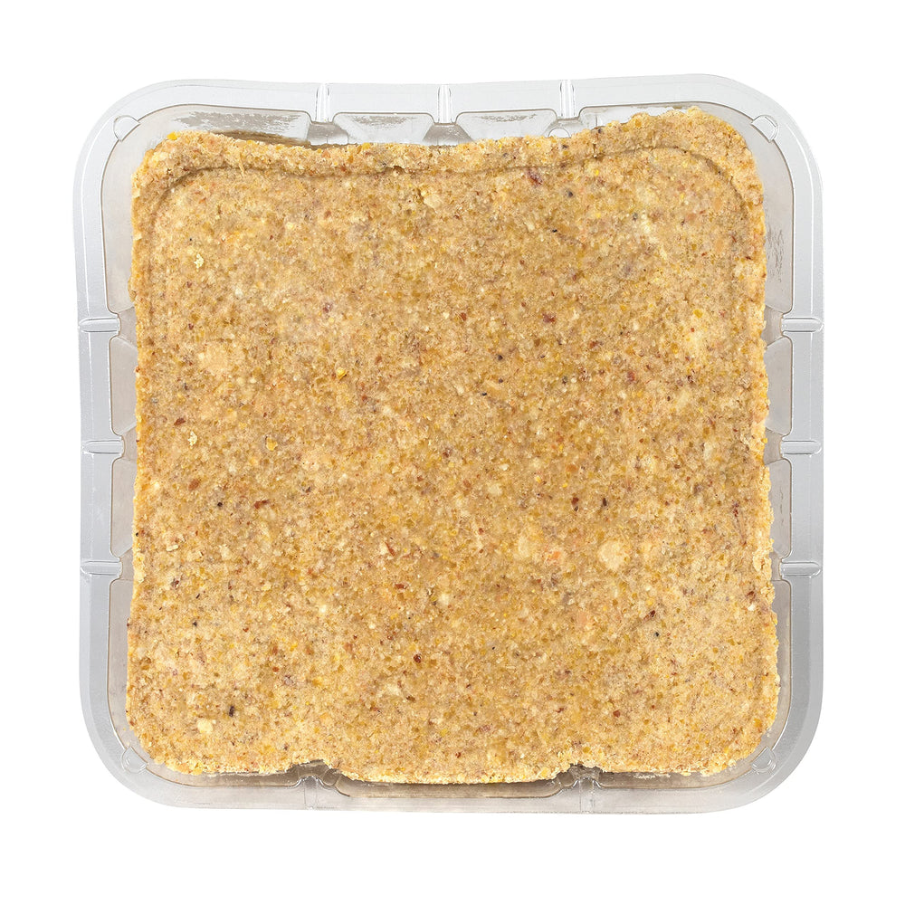 Close-up texture of C&S Peanut Delight cake revealing pressed peanut pieces