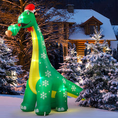 CACIRAL front view of 10 ft dinosaur inflatable showing festive hat and tree, grabs attention