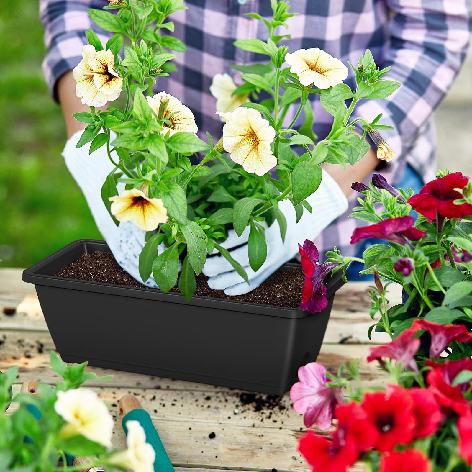 CADUKE planter filled with flowers on a balcony adding color and curb appeal