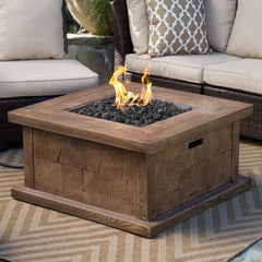 Calofulston lava rock arranged in a fire pit enhancing flame and warmth