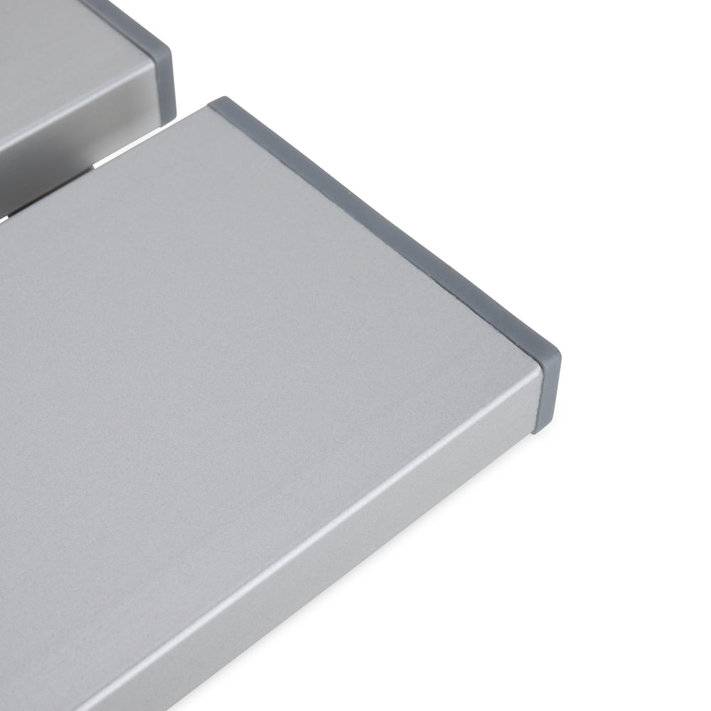 Camco table next to chair showing scale and convenient reach benefit