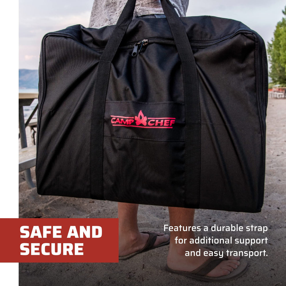 Camp Chef bag at campsite portraying weather-resistant liner protecting equipment outdoors