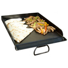 Camp Chef griddle beside a backpack to show portability and travel convenience